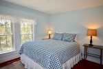 Sunny queen bedroom with dresser and closet and central AC vent